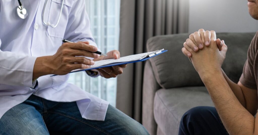 Man is talking to his doctor.